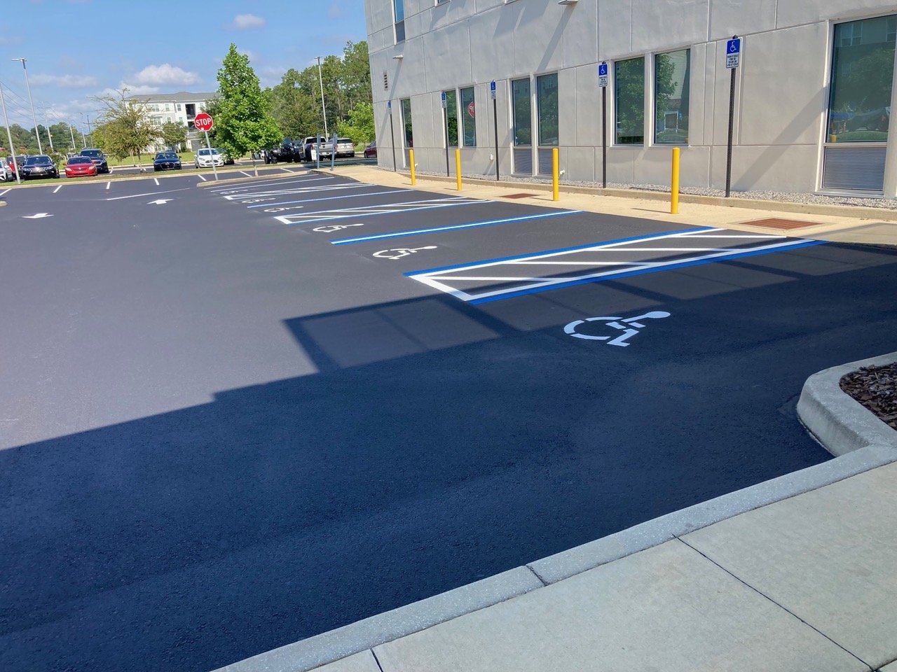 Image of ADA-compliant parking spaces in front of warehouse